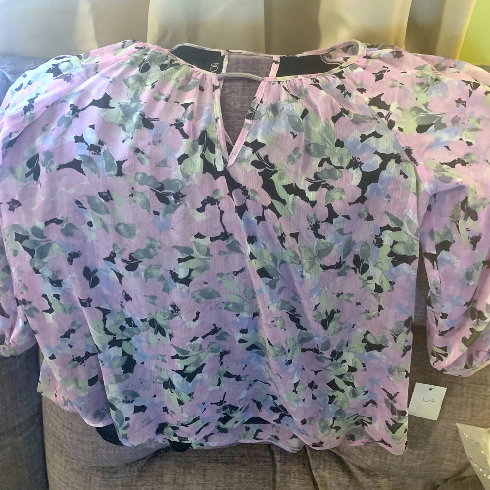 New BCX sheer sleeve top. Lined. Button cuff and slotted sleeves. Size small